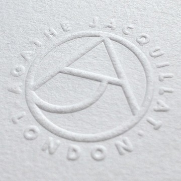 Embossed AJ monogram